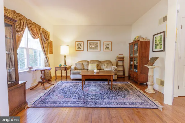 a living room with furniture and a rug