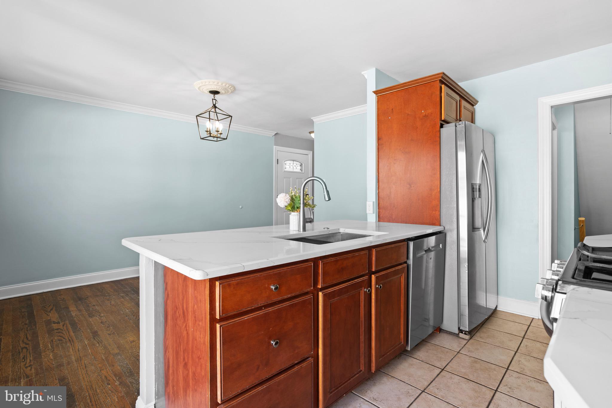 1309 Grace Road Swarthmore, PA 19081 - Photo 12 of 33 a kitchen with stainless steel appliances a sink and a refrigerator