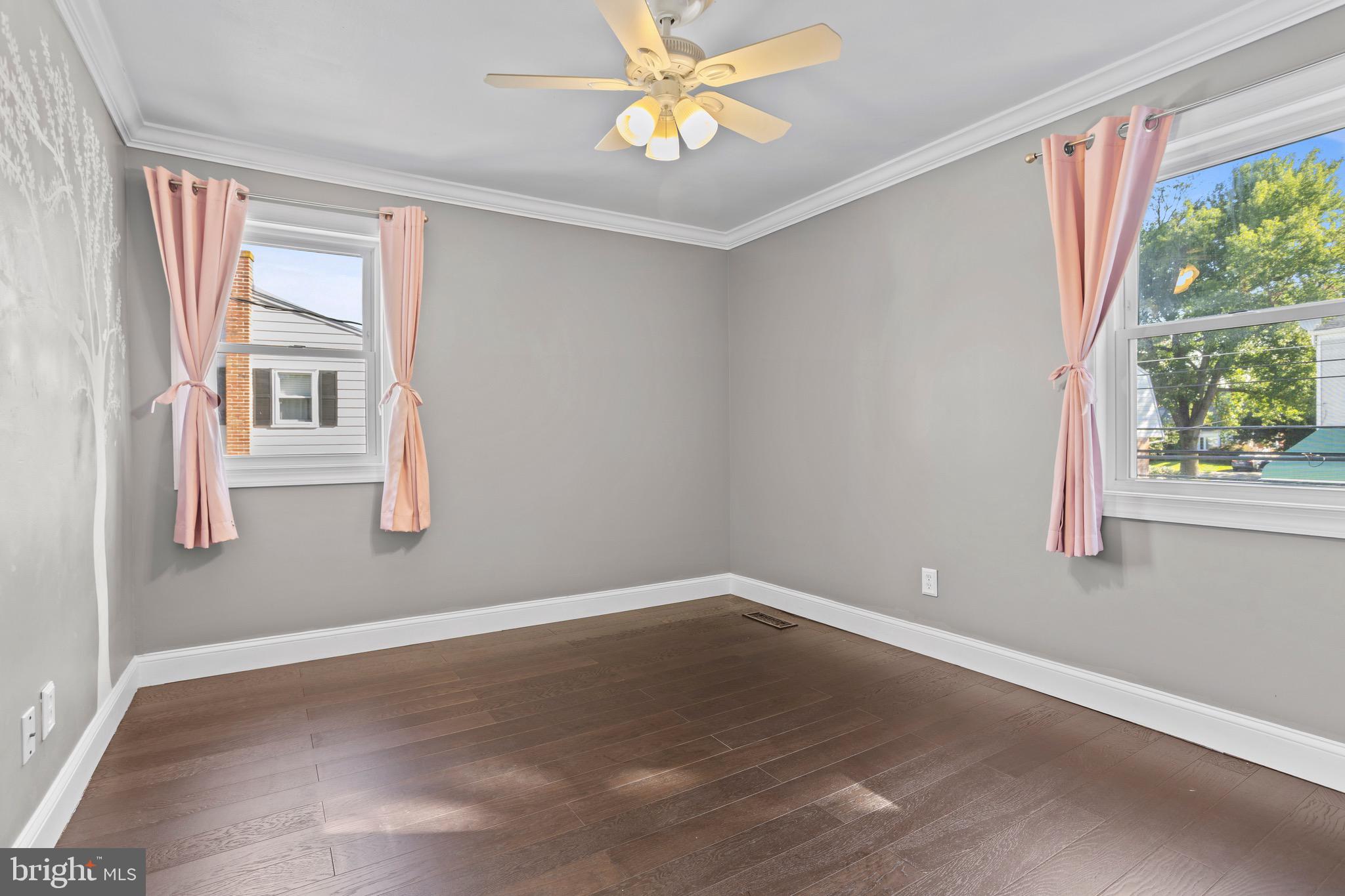 1309 Grace Road Swarthmore, PA 19081 - Photo 18 of 33 wooden floor in an empty room with a window