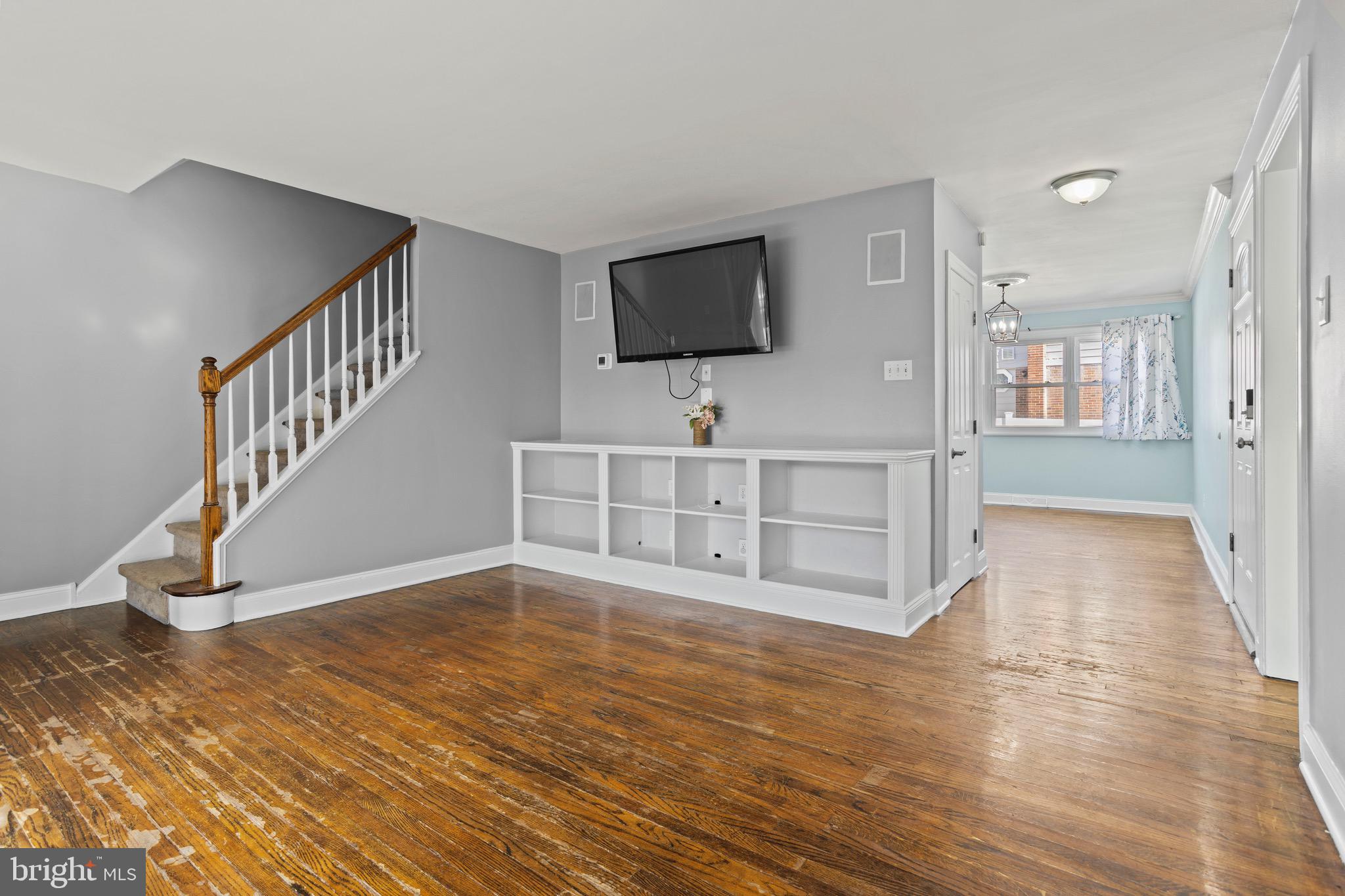 1309 Grace Road Swarthmore, PA 19081 - Photo 3 of 33 a view of an empty room with wooden floor and a bathroom