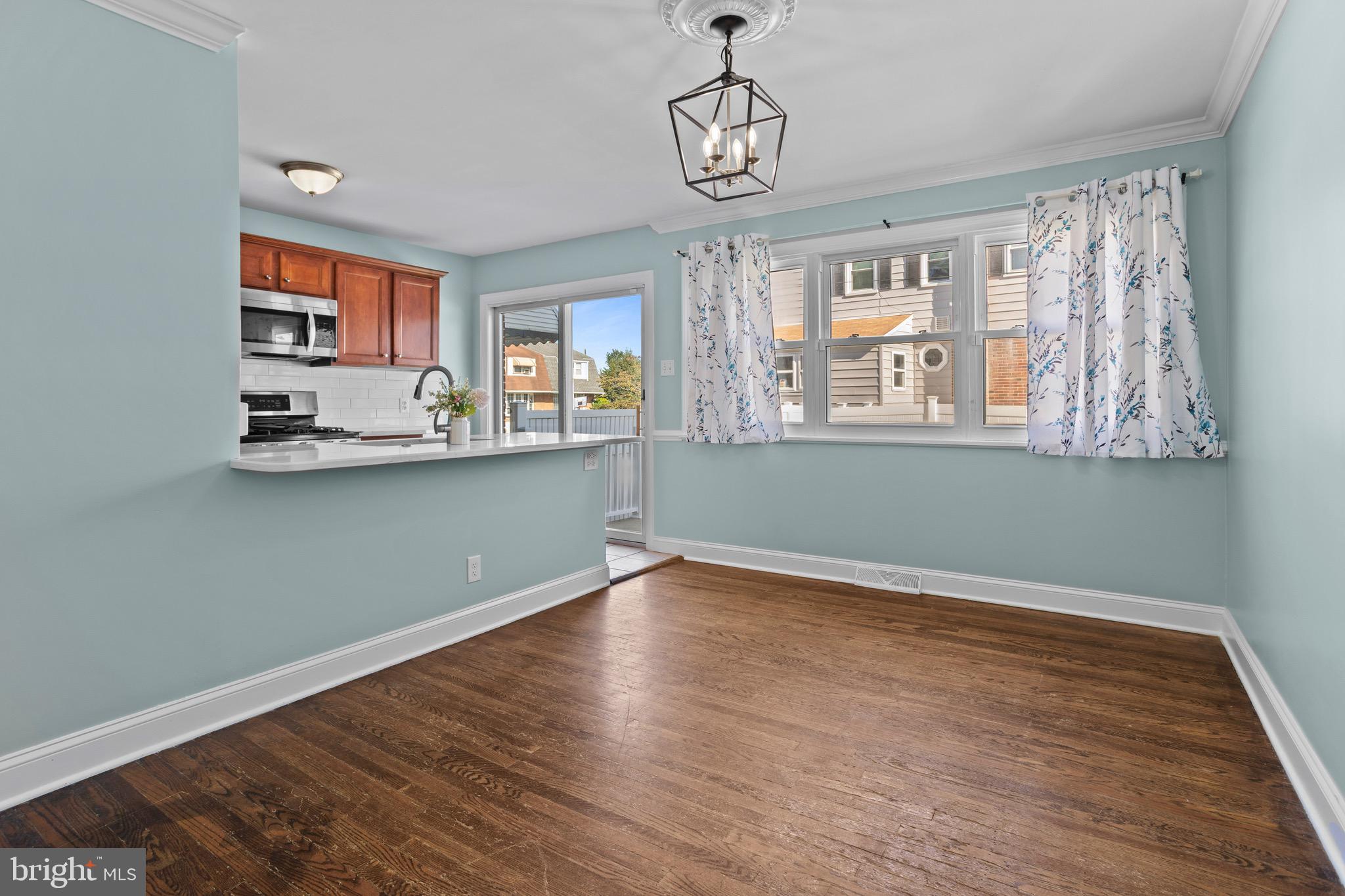 1309 Grace Road Swarthmore, PA 19081 - Photo 7 of 33 a view of empty room with wooden floor and window