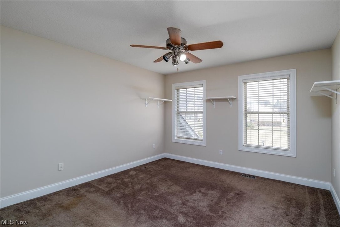 514 Silver Ridge Drive Akron, OH 44321 - Photo 27 of 47 Bedroom on 2nd level with ceiling fan and deep baseboard trim.