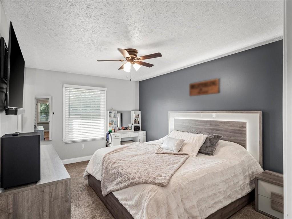 27 Spring Valley Street Slovan, PA 15078 - Photo 15 of 30 a bedroom with a large bed and a chandelier