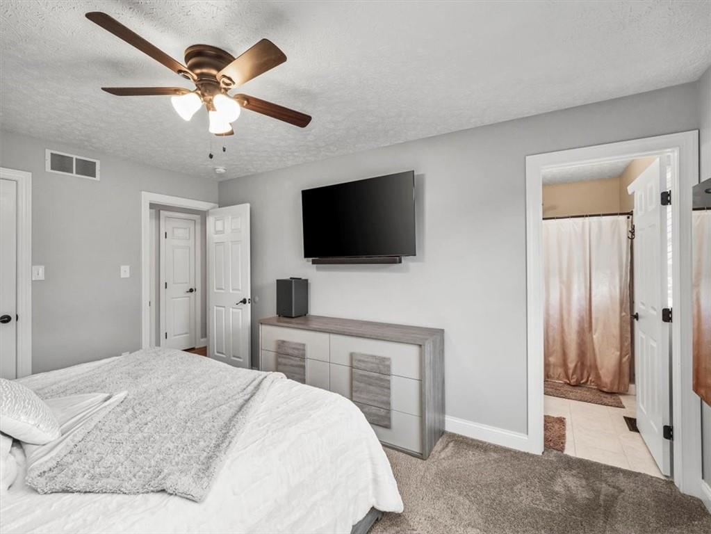 27 Spring Valley Street Slovan, PA 15078 - Photo 16 of 30 a bedroom with a bed and a flat screen tv