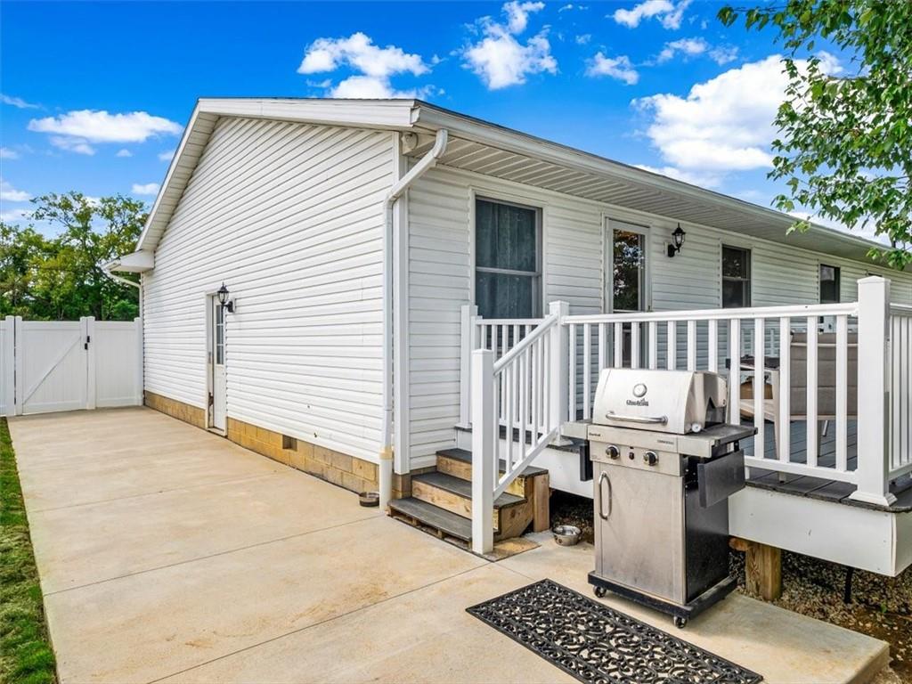 27 Spring Valley Street Slovan, PA 15078 - Photo 24 of 30 a view of a patio with a table and chairs