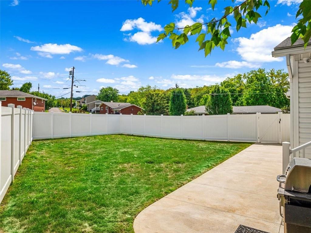 27 Spring Valley Street Slovan, PA 15078 - Photo 25 of 30 a view of a backyard with a garden and trees in the background