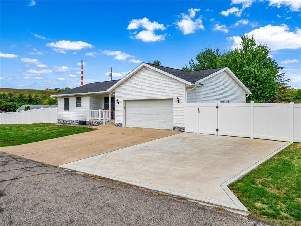 27 Spring Valley Street Slovan, PA 15078 - Photo 4 of 30 a view of garage yard and tree