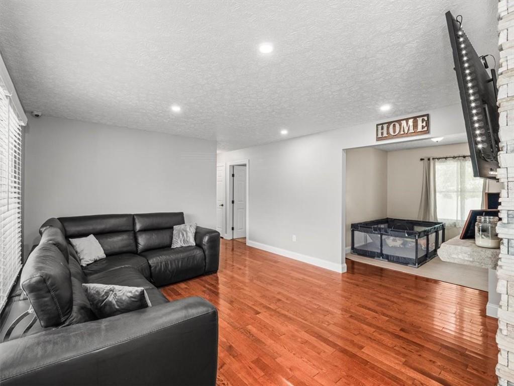 27 Spring Valley Street Slovan, PA 15078 - Photo 7 of 30 a living room with furniture and a hard wood floor