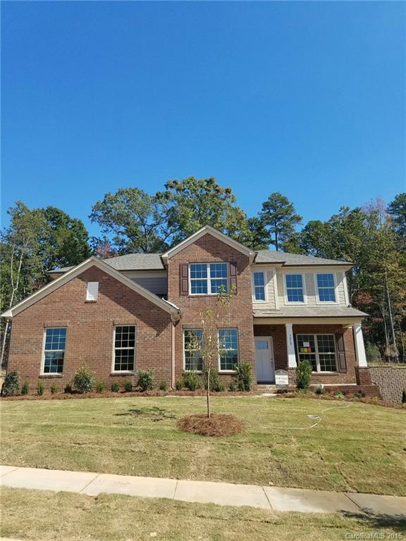 7010 Fallondale Road, Unit MB528 Waxhaw, NC 28173 - Photo 2 of 16 a front view of a house with a garden