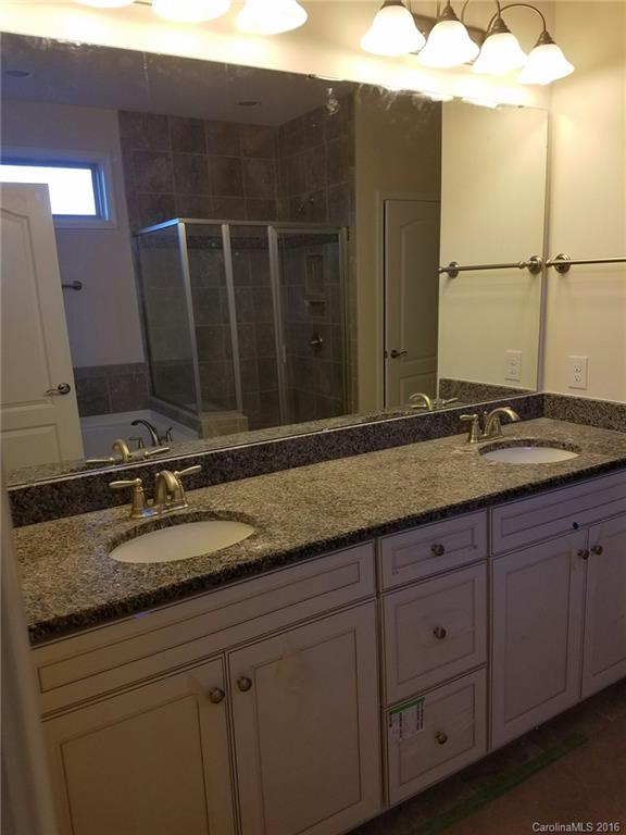 7010 Fallondale Road, Unit MB528 Waxhaw, NC 28173 - Photo 10 of 16 a bathroom with a sink and a mirror