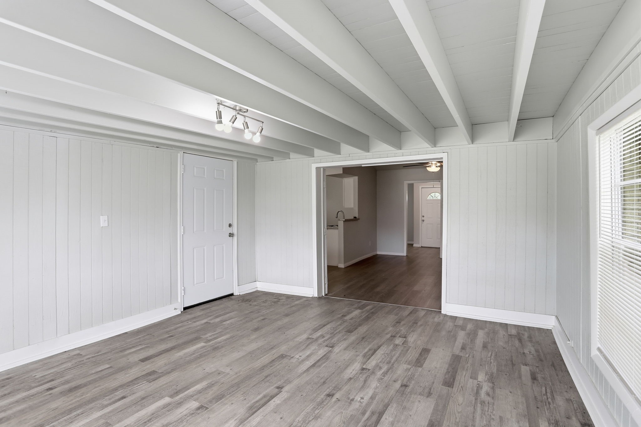 5242 Grace Point Lane Houston, TX 77048 - Photo 11 of 38 a view of an empty room with wooden floor and a window