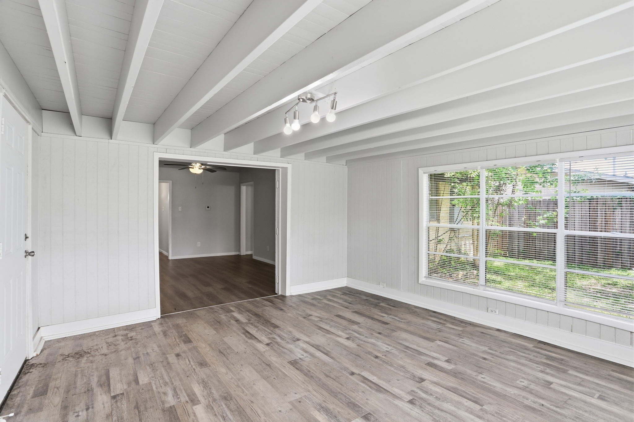 5242 Grace Point Lane Houston, TX 77048 - Photo 12 of 38 wooden floor in an empty room with a window