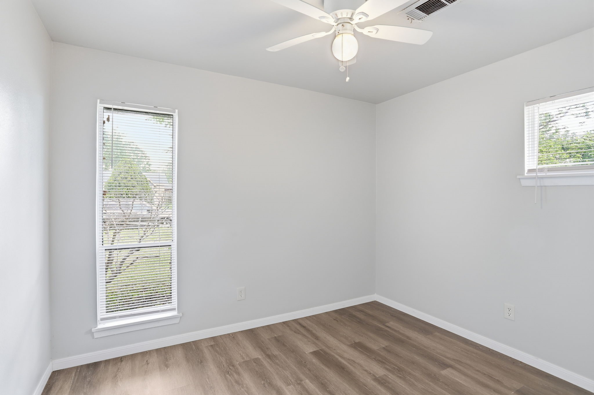 5242 Grace Point Lane Houston, TX 77048 - Photo 26 of 38 an empty room with a window and wooden floor