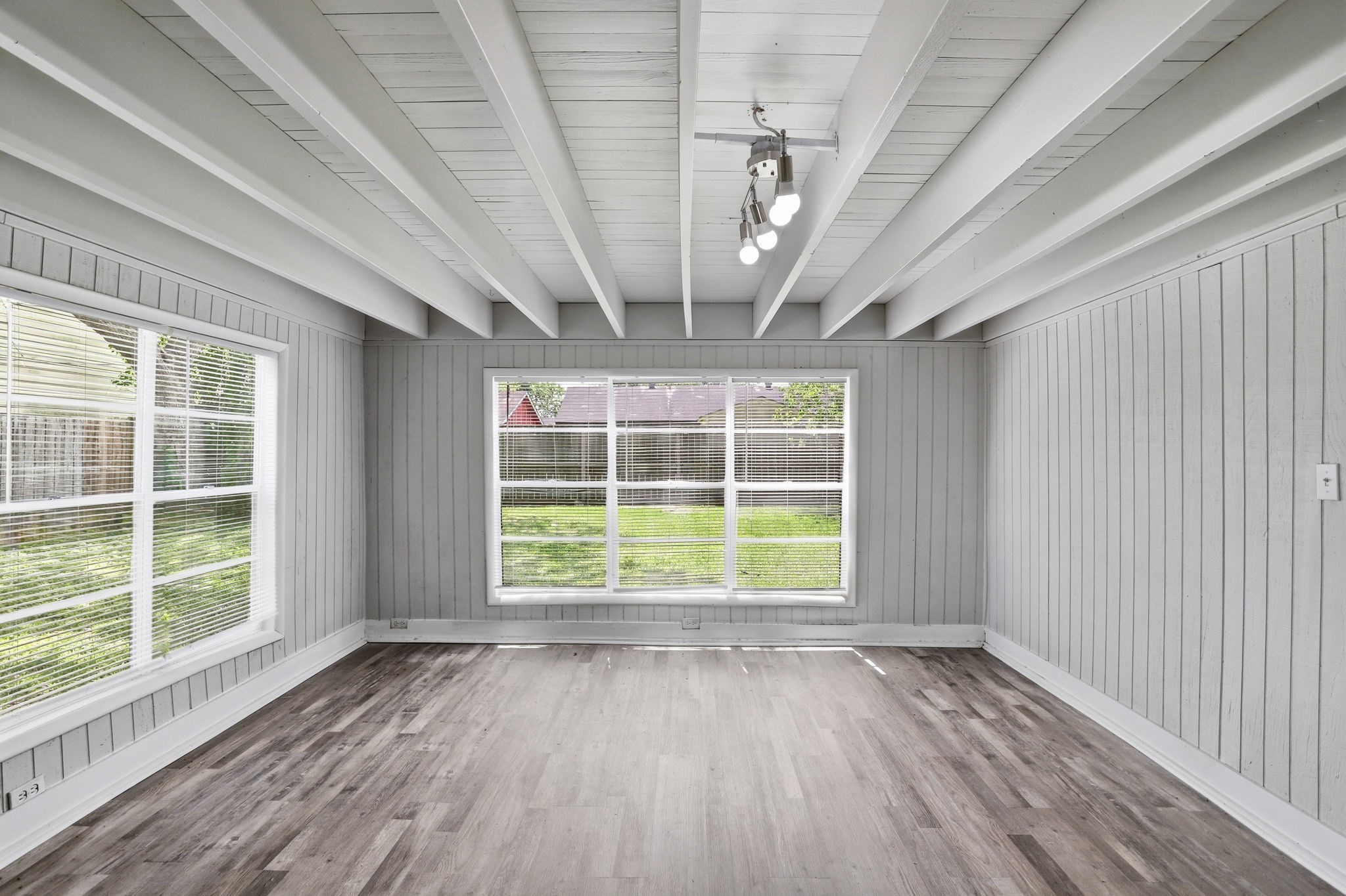 5242 Grace Point Lane Houston, TX 77048 - Photo 31 of 38 a view of an empty room with a window and wooden floor