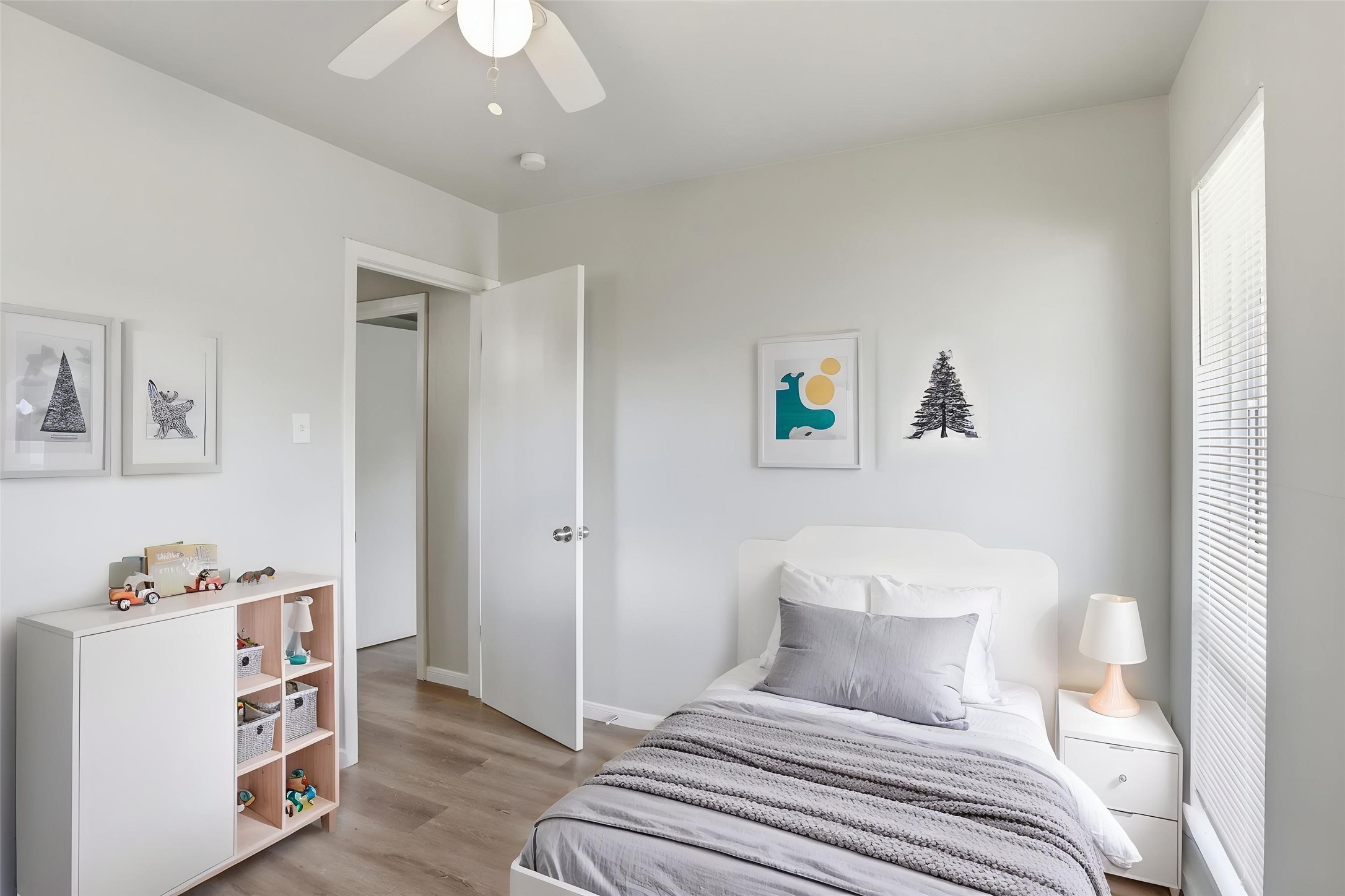 5242 Grace Point Lane Houston, TX 77048 - Photo 5 of 38 a bedroom with a bed and a chandelier