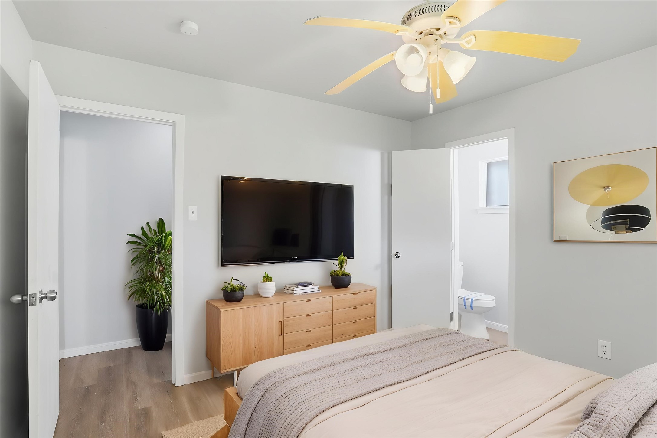 5242 Grace Point Lane Houston, TX 77048 - Photo 6 of 38 a bedroom with a bed and a flat screen tv