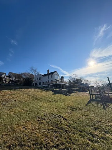 a view of a lake with houses in the back