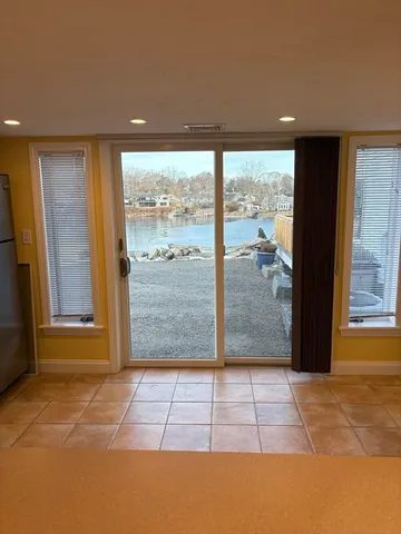 a kitchen with stainless steel appliances granite countertop a stove sink and cabinets
