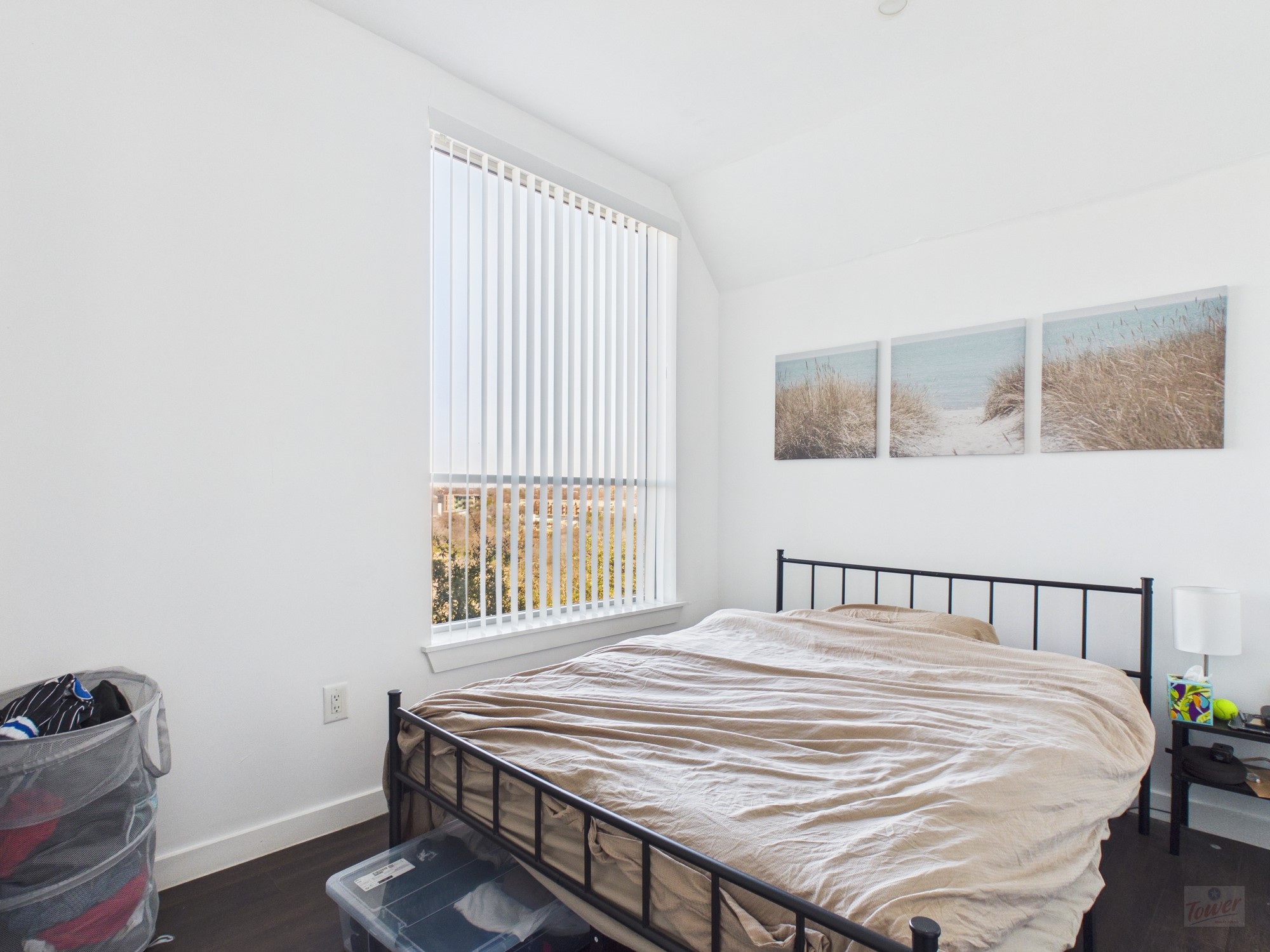 1010 West 26th Street, Unit 201 Austin, TX 78705 - Photo 5 of 8 a bedroom with a bed and a window