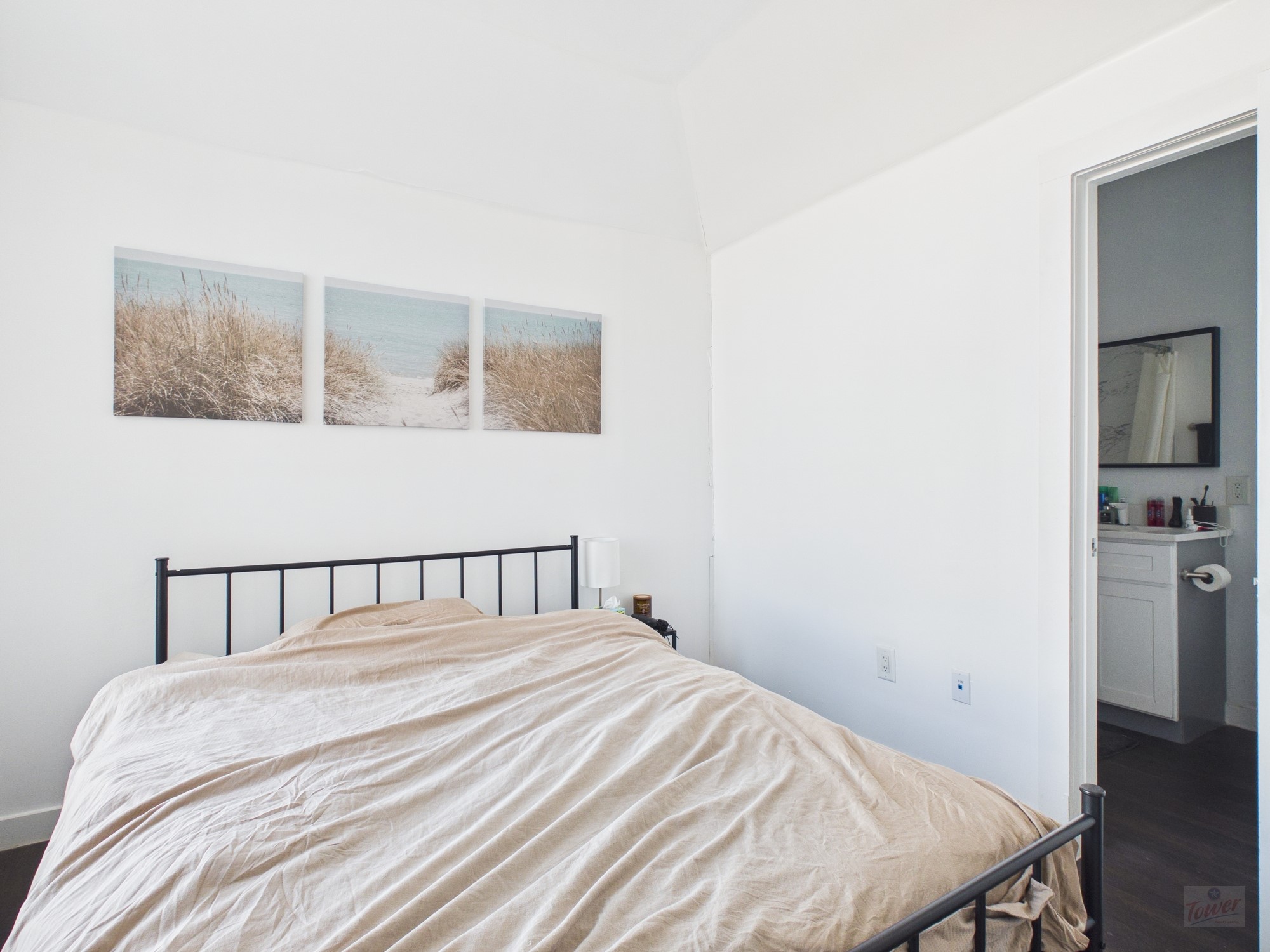 1010 West 26th Street, Unit 201 Austin, TX 78705 - Photo 7 of 8 a bedroom with a bed and a window