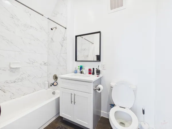 a bathroom with a sink a toilet and a bathtub