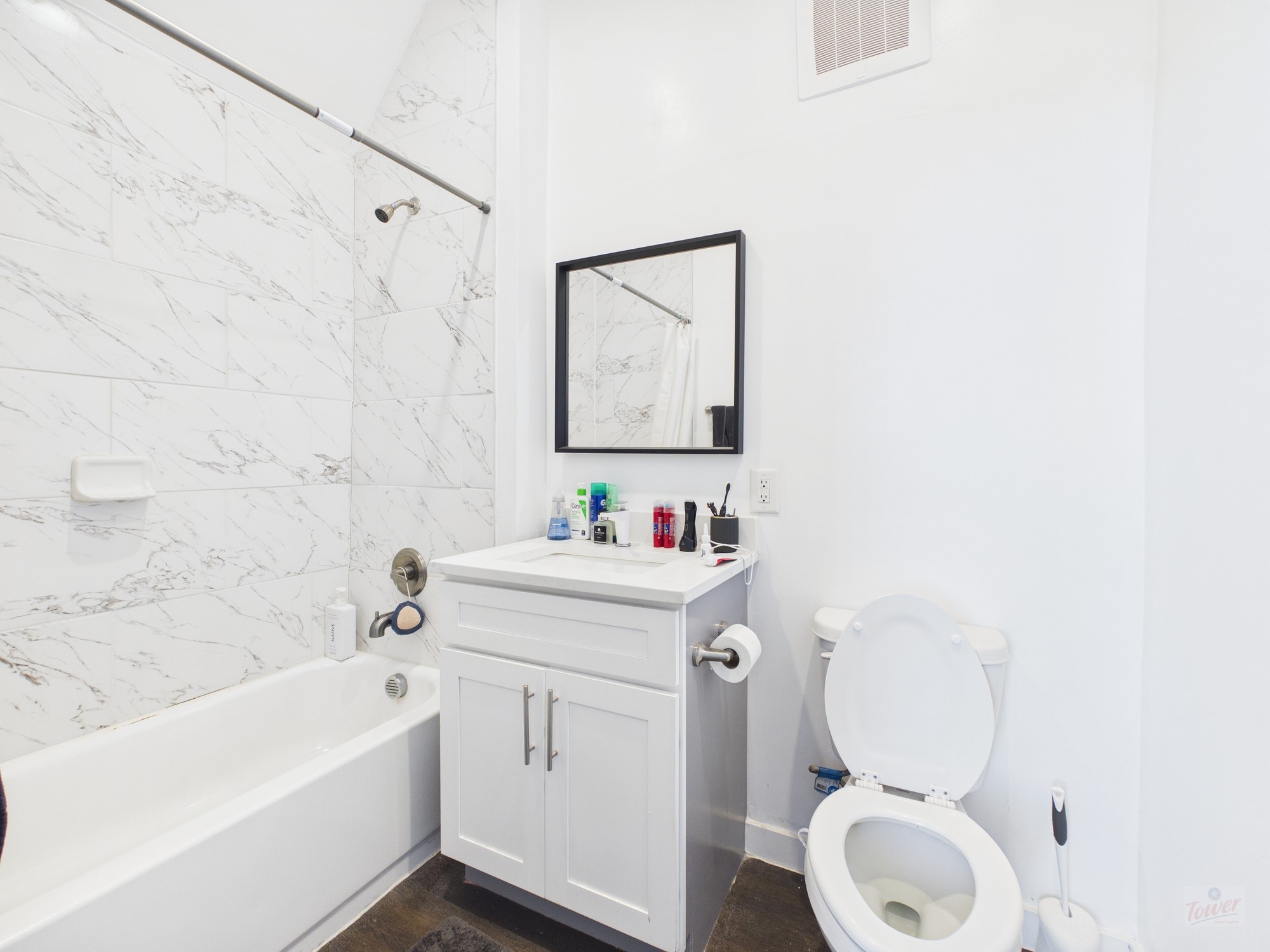 1010 West 26th Street, Unit 201 Austin, TX 78705 - Photo 8 of 8 a bathroom with a sink a toilet and a bathtub