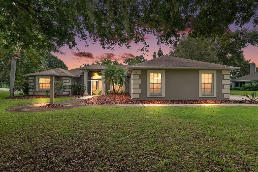 434 Oak View Drive Tavares, FL 32778 - Photo 1 of 1 a front view of a house with a garden