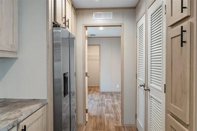 a view of a kitchen from the hallway