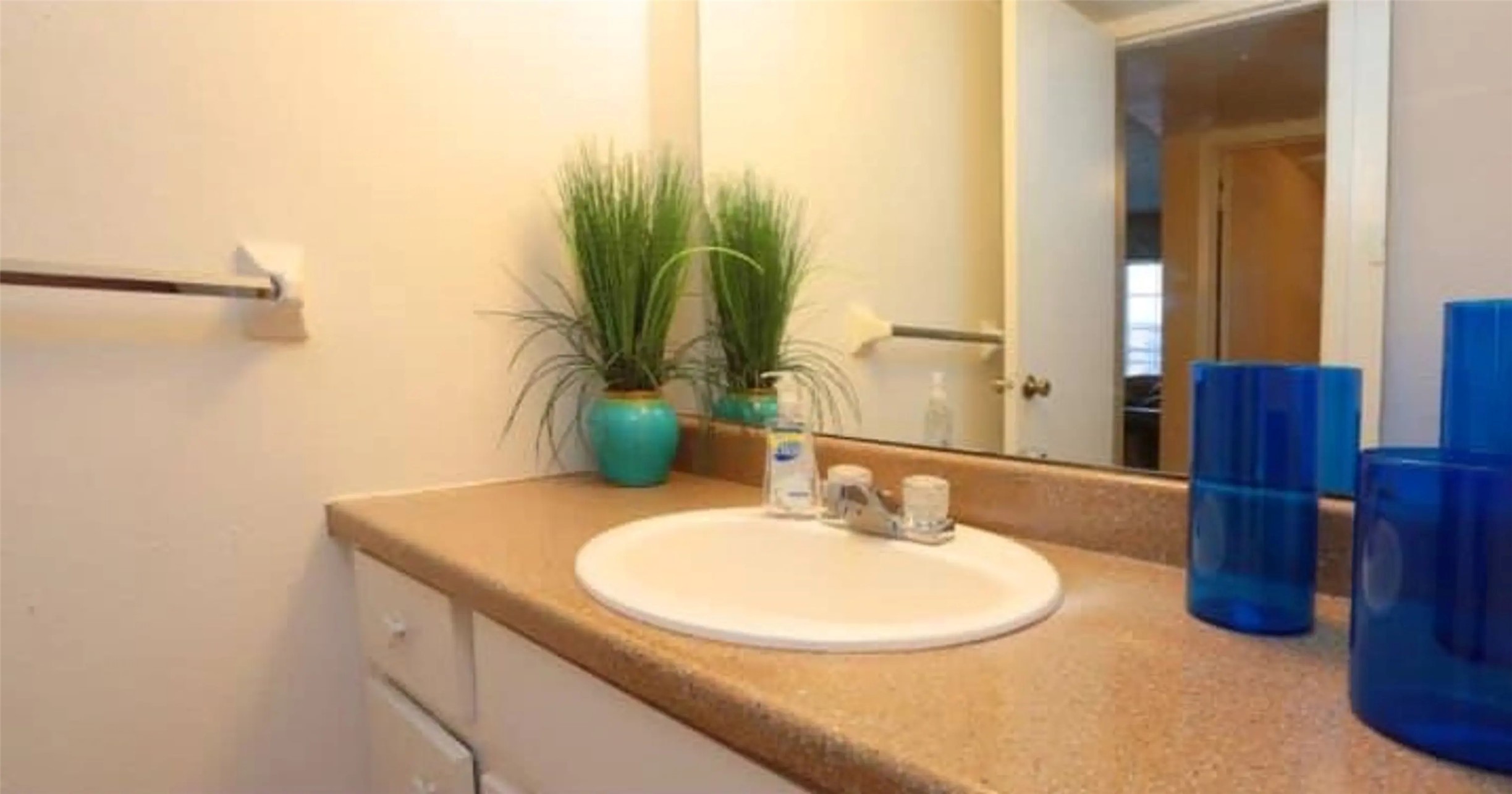 4300 Shaver Street, Unit 86 Houston, TX 77034 - Photo 3 of 9 a bathroom with a sink and a mirror