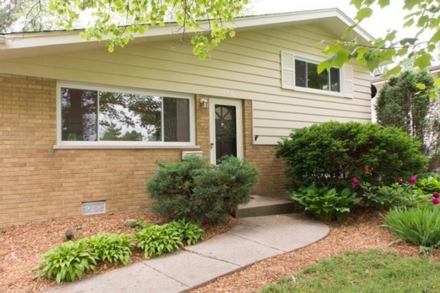 716 Ranch Road Wheaton, IL 60187 - Photo 2 of 24 a front view of a house with garden