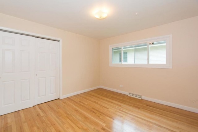 716 Ranch Road Wheaton, IL 60187 - Photo 11 of 24 an empty room with a window
