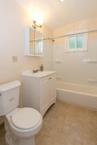 716 Ranch Road Wheaton, IL 60187 - Photo 13 of 24 a bathroom with a sink a toilet and shower