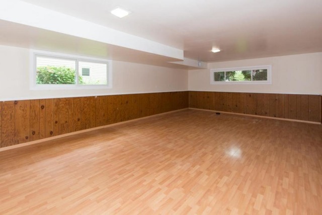 716 Ranch Road Wheaton, IL 60187 - Photo 14 of 24 an empty room with wooden floor and windows