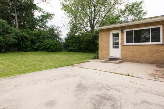 716 Ranch Road Wheaton, IL 60187 - Photo 19 of 24 a house with a yard