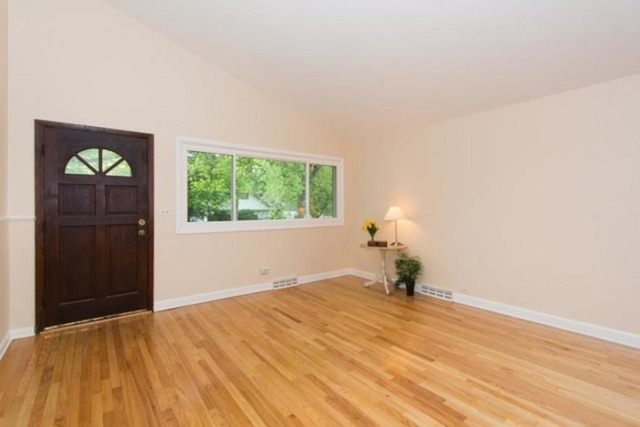 716 Ranch Road Wheaton, IL 60187 - Photo 3 of 24 a bedroom with a bed and a window