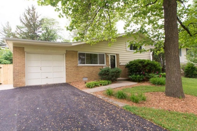 716 Ranch Road Wheaton, IL 60187 - Photo 23 of 24 front view of a house with a yard and an trees
