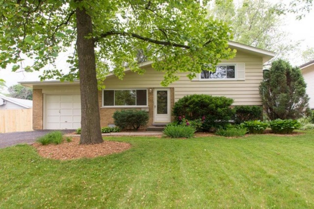 716 Ranch Road Wheaton, IL 60187 - Photo 24 of 24 a front view of a house with a yard and porch