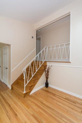 716 Ranch Road Wheaton, IL 60187 - Photo 9 of 24 a view of an empty room with wooden floor and a window
