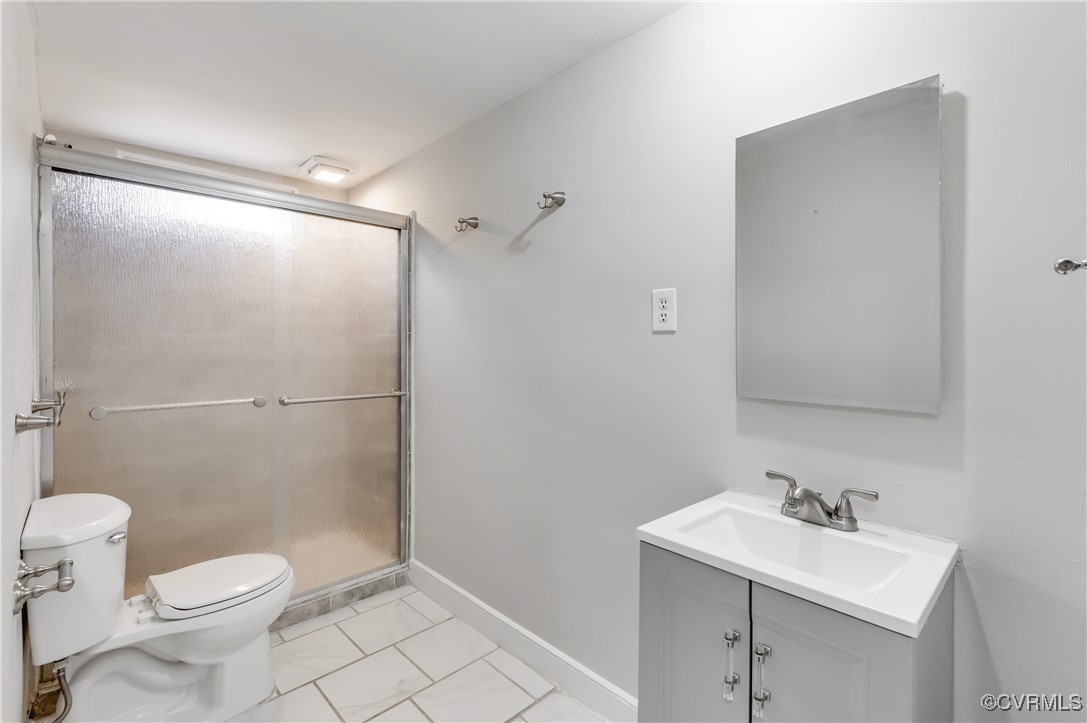 2821 Dumbarton Road Henrico, VA 23228 - Photo 29 of 37 Bathroom featuring vanity, toilet, and a shower wi