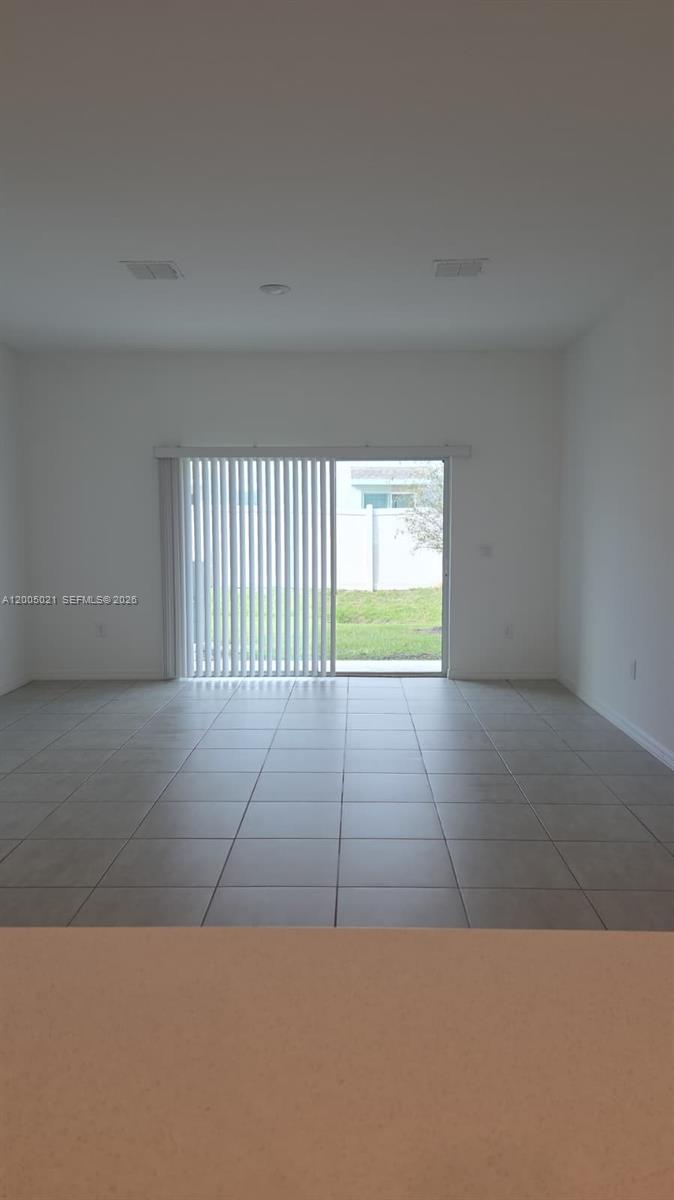 3230 Skyline Loop, Unit 3230 Kissimmee, FL 34758 - Photo 3 of 8 a view of an empty room with a window