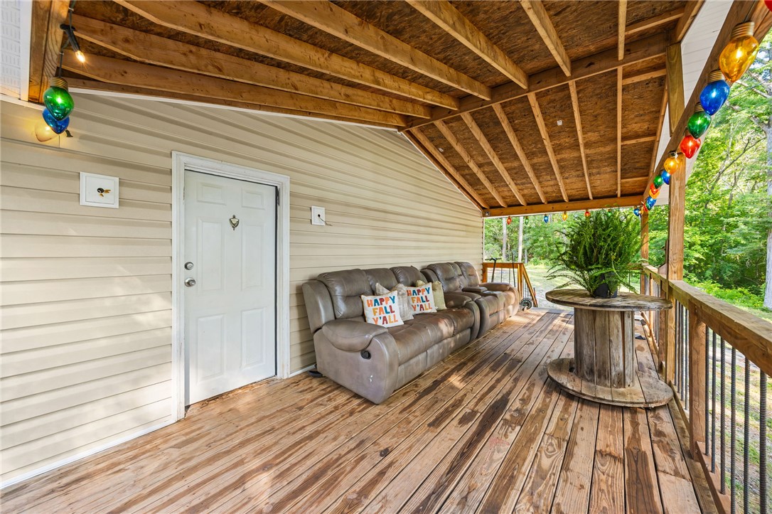 217 Old River Road Pelzer, SC 29669 - Photo 21 of 30 Relax outdoors on this inviting porch featuring durable wooden decking and exposed beam ceiling.