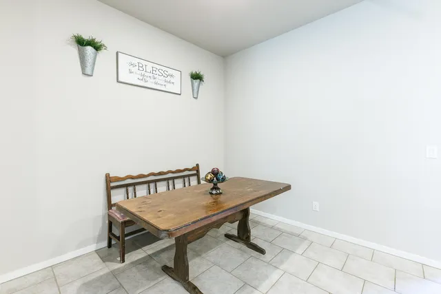 a view of a table and chairs in the room