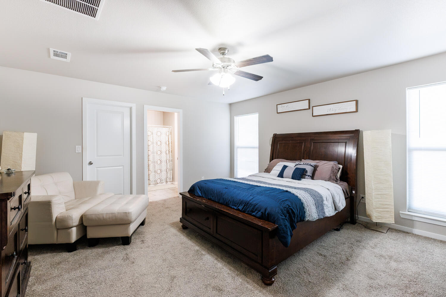 7322 29th Street Lubbock, TX 79407 - Photo 18 of 40 a bedroom with a bed and ceiling fan