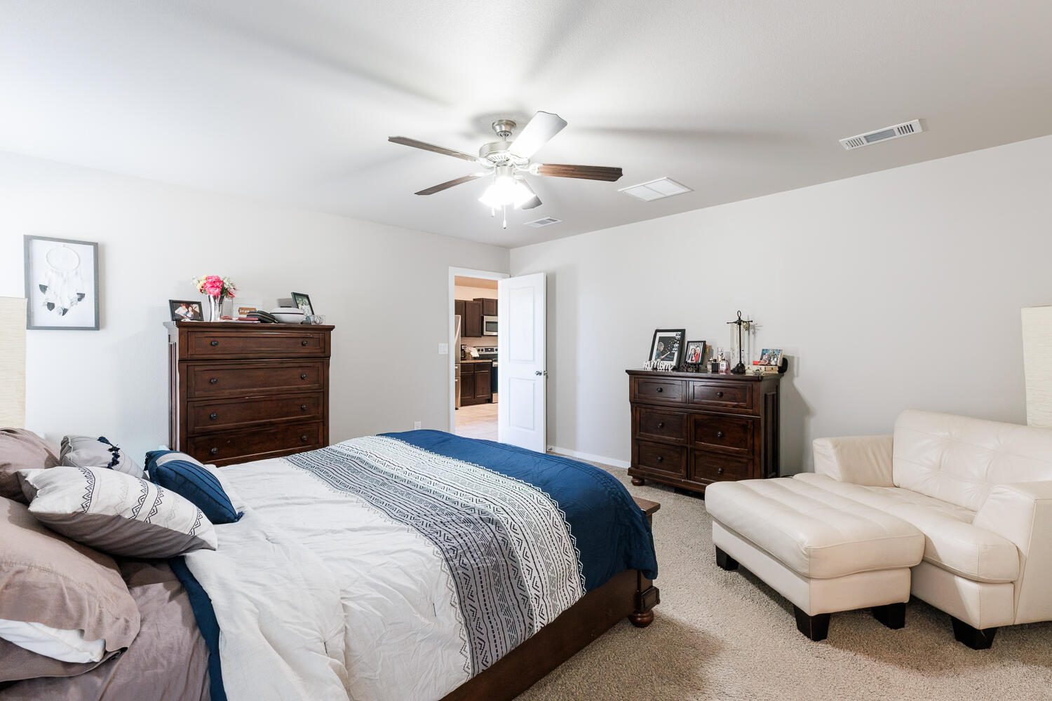 7322 29th Street Lubbock, TX 79407 - Photo 19 of 40 a bedroom with a bed and dresser