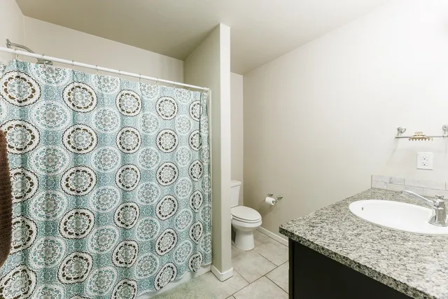 a bedroom with a bed and dresser