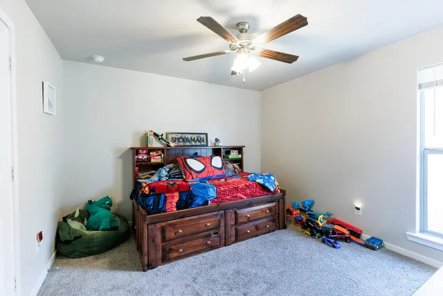 a bathroom with a granite countertop shower and a sink