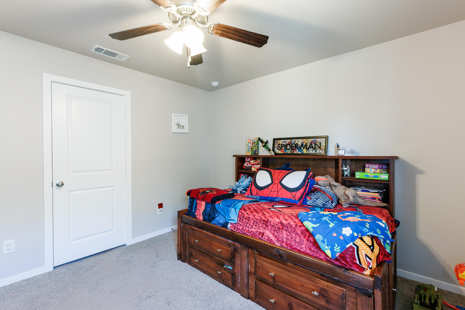 7322 29th Street Lubbock, TX 79407 - Photo 24 of 40 a bedroom with furniture and a chandelier fan