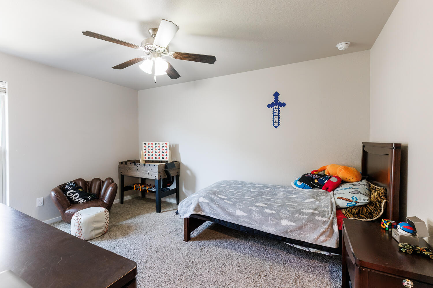 7322 29th Street Lubbock, TX 79407 - Photo 28 of 40 a bedroom with furniture and a chandelier