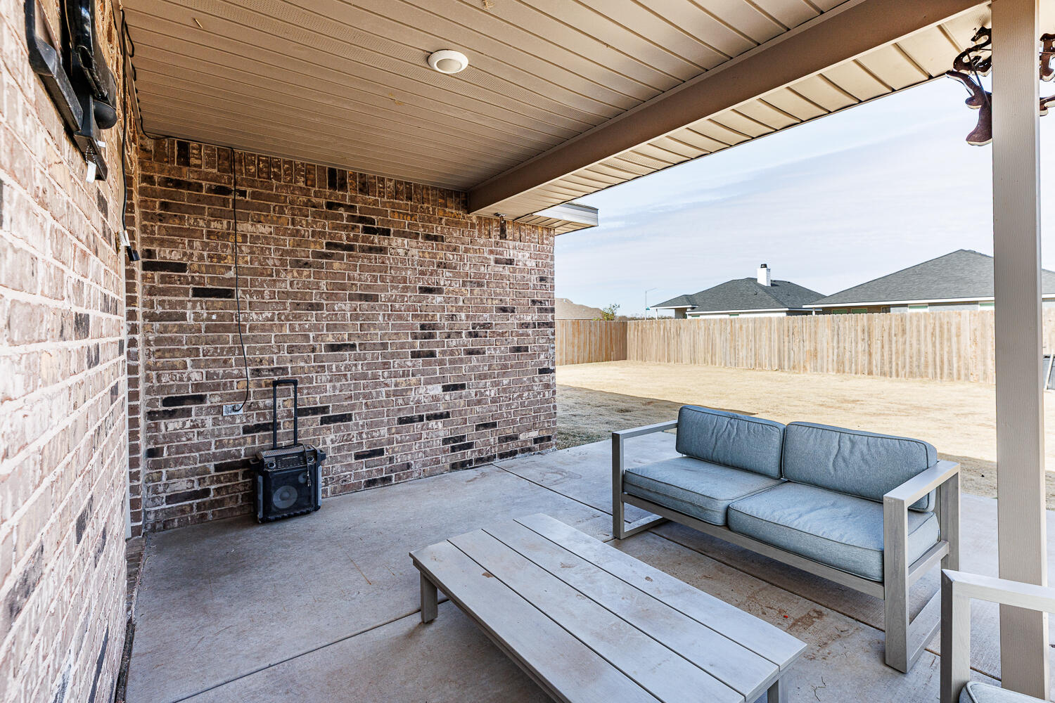 7322 29th Street Lubbock, TX 79407 - Photo 29 of 40 a balcony with furniture and a fireplace