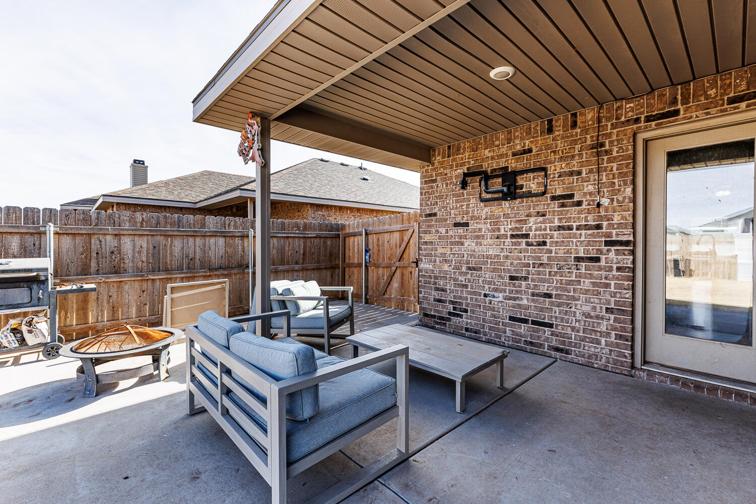 7322 29th Street Lubbock, TX 79407 - Photo 30 of 40 a view of a patio with a table and chairs